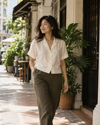 AI-generated editorial concept: cream short-sleeve linen shirt styled in Singapore